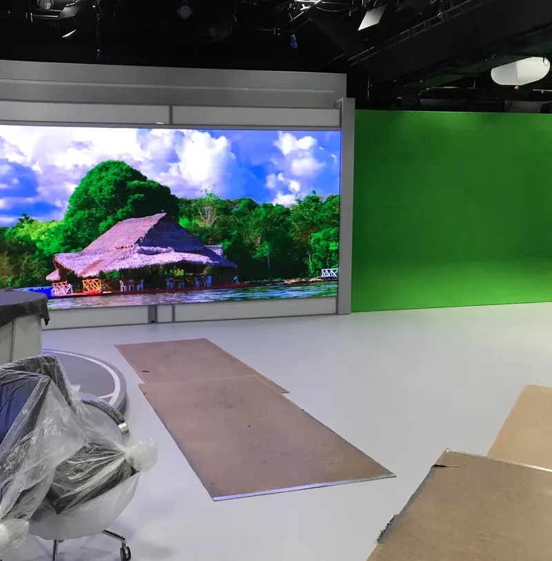 Al Araby TV's Park Royal Studio 2 during the build, with an LED video wall beside the green-screen cyclorama and protective boards on the floor.